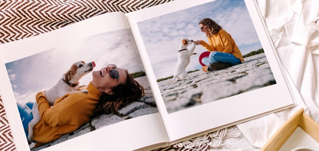 Closed photobook showing photos of a son and father on the cover that reads 'my dad is my superhero'.