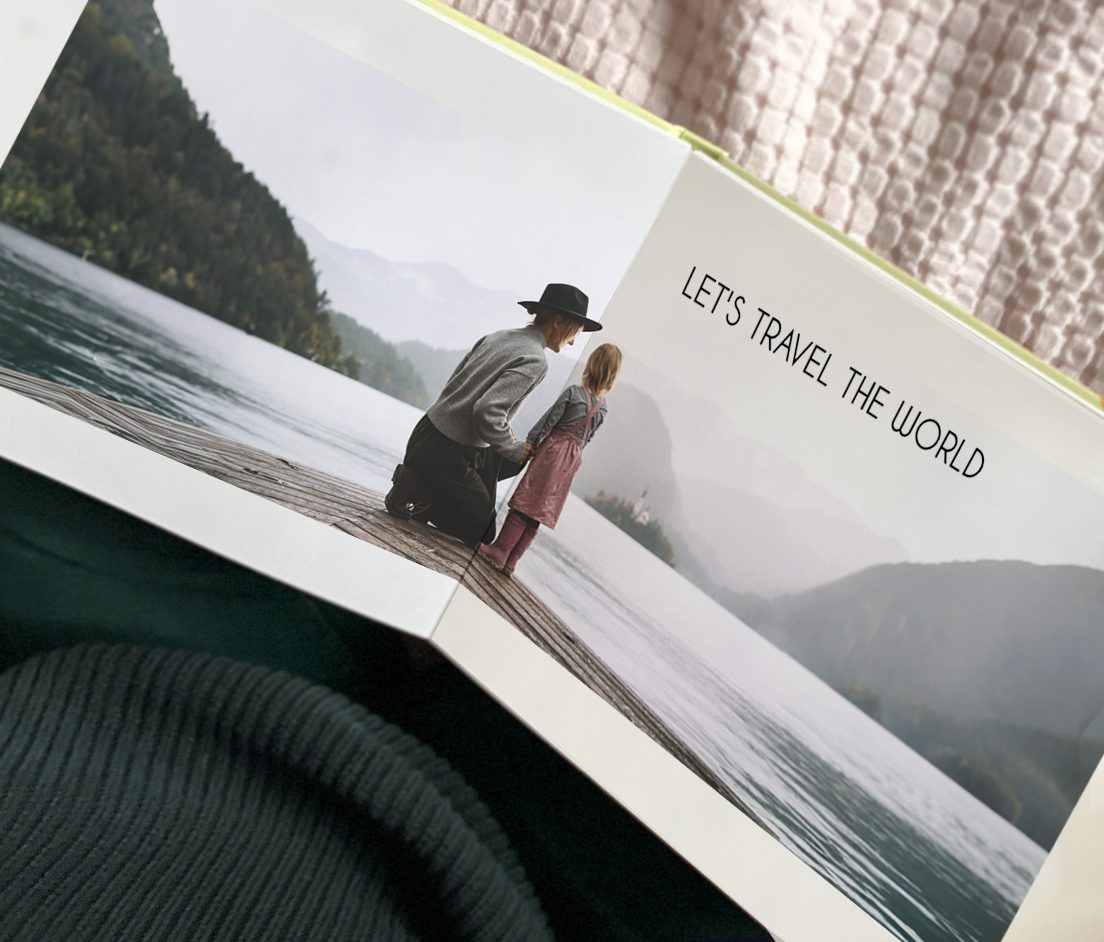 Open layflat photobook with photos of a boho couple for a wedding